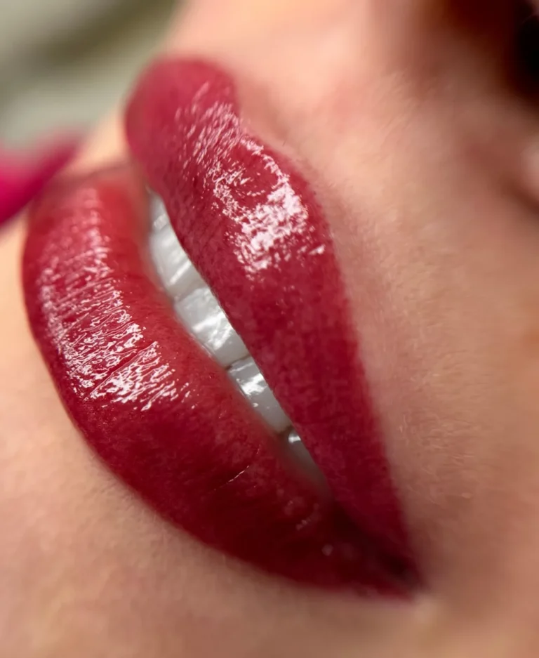 Close-up of lips with saturated red lip pigmentation